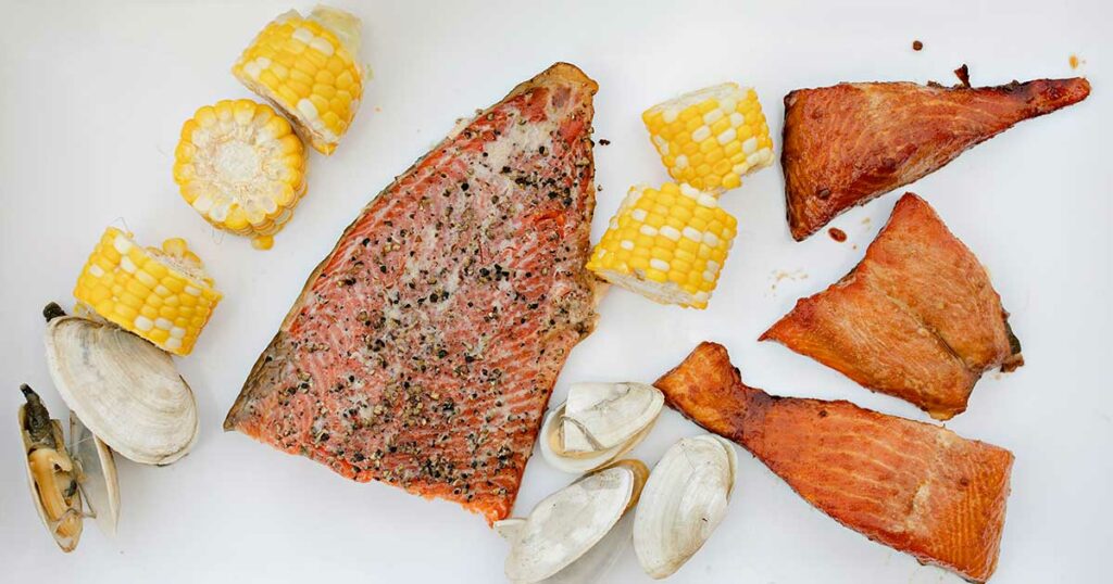 seafood and corn on a white background