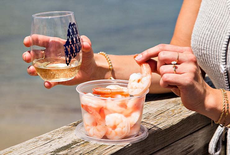Eating shrimp on a dock with wine